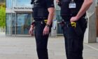 Police Scotland officers armed with tasers at the Scottish Parliament, 
Edinburgh.