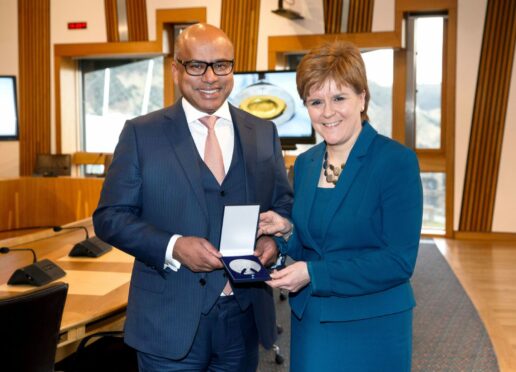 Nicola Sturgeon presents Sanjeev Gupta with a special medal in 2018 to mark two years since the GFG deal
