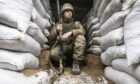 A Ukrainian soldier in a trench in the Donetsk region last week