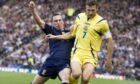 Scotland’s Scott Brown tackles Andriy Shevchenko when Ukraine last visited Hampden in 2007