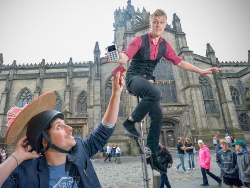 Street performers with the iZettle reader in Edinburgh (Julie Howden/iZettle)