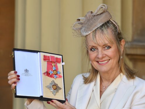 Lesley “Twiggy” Lawson holds her Dame Commander of the Order of the British Empire award (John Stillwell/PA)