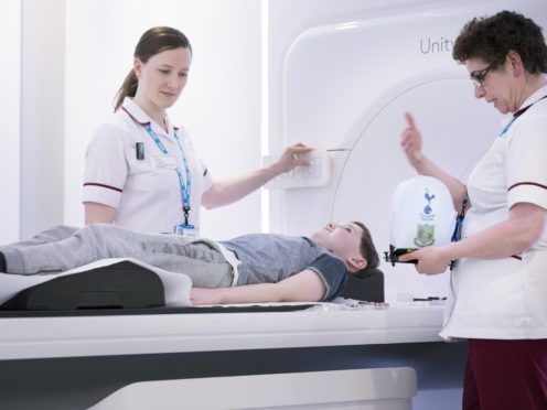 Alex Burchell has the first paediatric scan on the MR Linac machine (The Royal Marsden/PA)