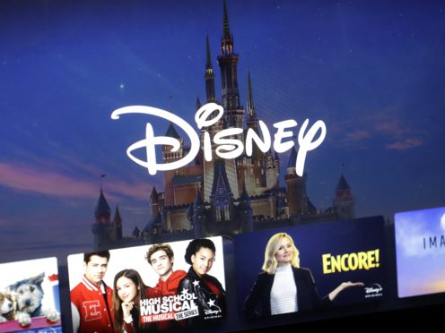 A Disney logo forms part of a menu for the Disney Plus movie and entertainment streaming service on a computer screen (Steven Senne/AP)