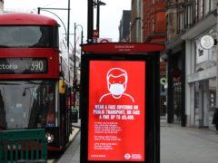 A bus advert advising the wearing of face coverings in Oxford Street, London (Luciana Guerra/PA)
