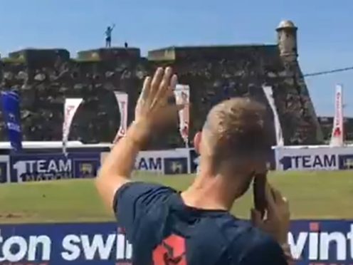 Joe Root shares a phone call with England fan Rob Lewis, who waited 10 months in Sri Lanka for the team to arrive (ECB/@englandcricket)