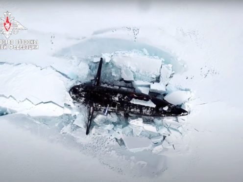 In this handout photo taken from a footage released by Russian Defense Ministry Press Service on March 26, 2021, A Russian nuclear submarine breaks through the Arctic ice during military drills at an unspecified location. Russian President Vladimir Putin on Friday hailed the military’s performance during recent Arctic drills, part of Moscow’s efforts to expand its presence in the polar region. (Russian Defense Ministry Press Service via AP)