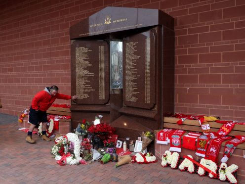 Fans pay their respects at the Hillsborough memorial (Martin Rickett/PA)