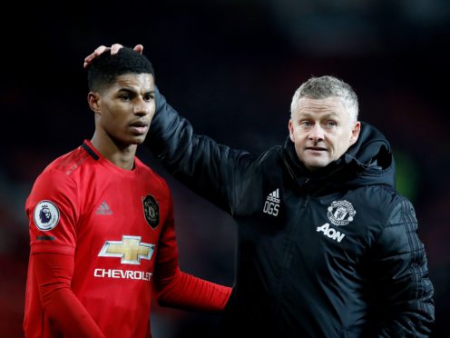 Ole Gunnar Solskjaer embraces Marcus Rashford (Martin Rickett/PA)
