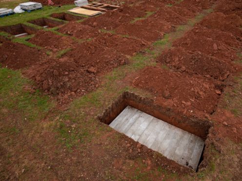 Rows of new graves at High Wood Cemetery, Nottingham (Jacob King/AP)