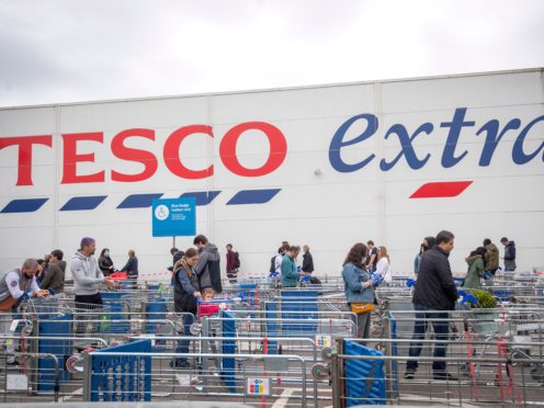 Tesco’s profits tumbled by around a fifth over the past year after coronavirus costs of almost £900m offset surging sales (Victoria Jones/PA)