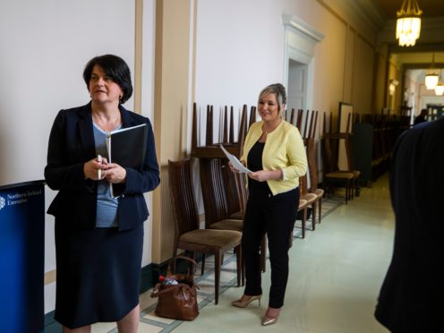 First Minster Arlene Foster (left), and deputy First Minister Michelle O’Neill in the hallway together before a Northern Ireland Executive press conference (PA)