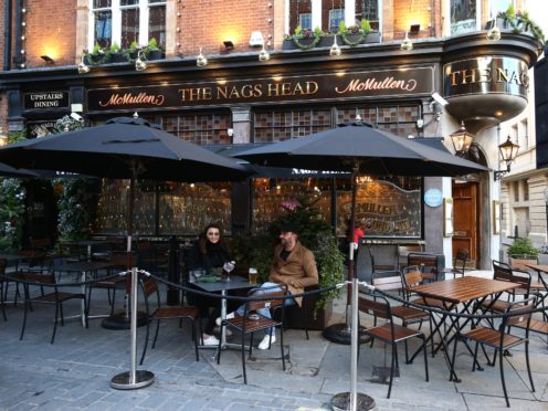 People drinking outdoors at The Nags Head pub in Covent Garden, London (Yui Mok/PA)