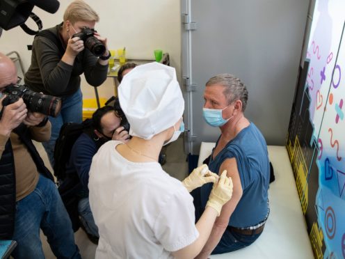 A medical worker administers a jab of Russia’s Sputnik V coronavirus vaccine in Moscow, Russia (Pavel Golovkin/AP)