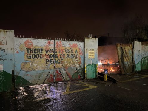 A car on fire at the Peace Gates in Lanark Way, Belfast (PA)