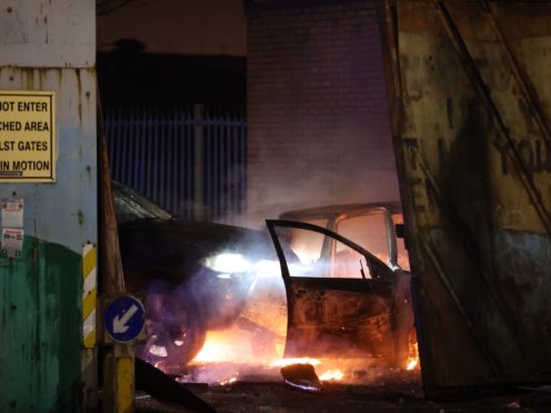 Cars that people on the loyalist side tried to drive through the Peace Gates in Lanark Way, Belfast, during further unrest in Belfast (Liam McBurney/PA)