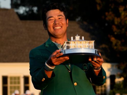 Hideki Matsuyama holds the trophy after winning the 85th Masters (David J. Phillip/AP)
