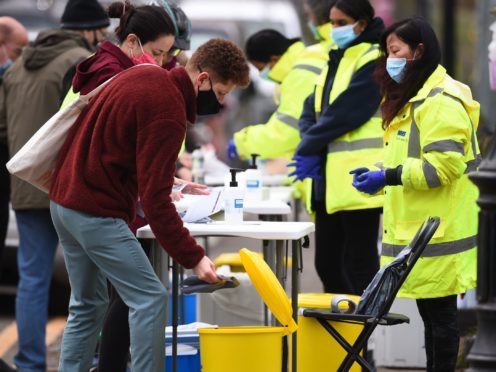 People take part in coronavirus surge testing on Clapham Common, south London (Kirsty O’Connor/PA)