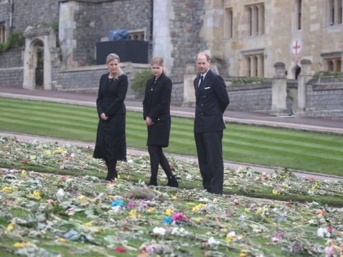 The Countess of Wessex, Lady Louise Windsor and the Earl of Wessex view flowers outside St George’s Chapel, at Windsor Castle, Berkshire (Steve Parsons/PA)