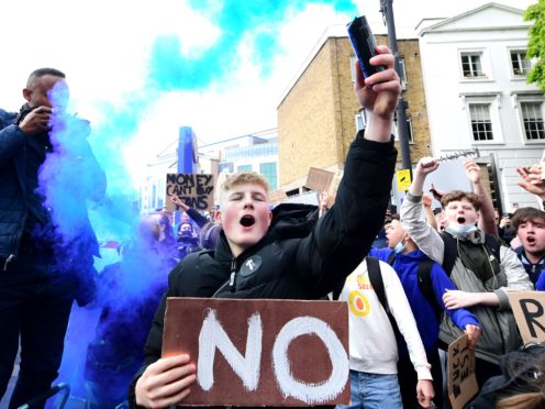 Chelsea fans outside Stamford Bridge protest against the club’s involvement in the proposed European Super League (Ian West/PA)