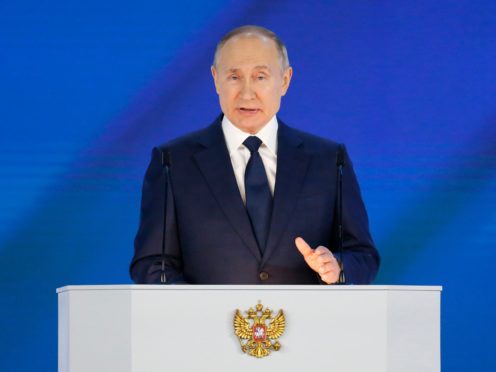 Russian President Vladimir Putin gives his annual state of the nation address in Manezh, Moscow, Russia, Wednesday, April 21, 2021. Putin’s state-of-the-nation speech comes amid a new surge in tensions with the West over a Russian troop buildup near the border with Ukraine and a hunger strike by jailed Russian opposition leader Alexei Navalny protesting a lack of adequate medical treatment in prison. (AP Photo/Alexander Zemlianichenko, Pool)