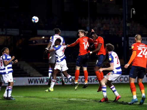 Luton’s Glen Rea heads at goal during the draw with Reading (Tim Goode/PA)