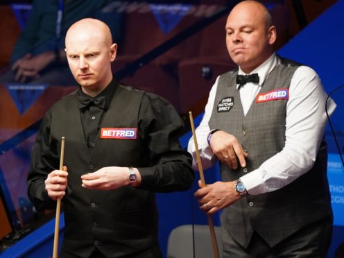 Anthony McGill, left, is ahead of Stuart Bingham going into the final session of their quarter-final in Sheffield (Zac Goodwin/PA)