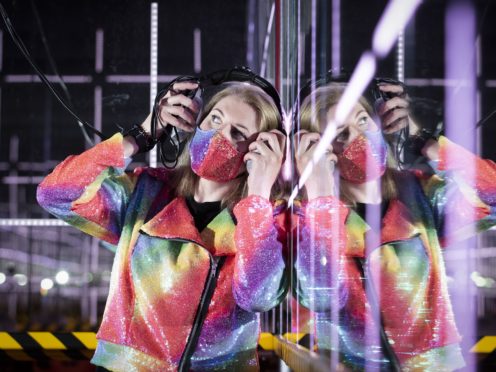 Gallery assistant Naomi Robb in one of the light and music installations (Jane Barlow/PA)