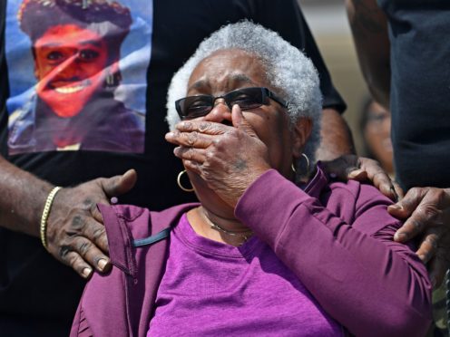 Jessie Hamilton reacts as she is presented with a cheque to pay off her mortgage (Hilary Scheinuk/The Advocate via AP)