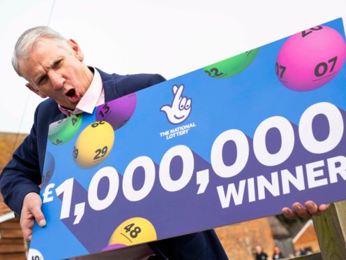 John McFadden from Southampton celebrates winning £1m on a National Lottery scratchcard (Handout/PA)
