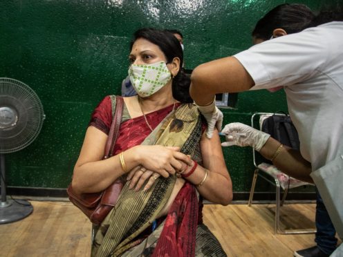 Urgent action is needed to help India and other countries get jabs to their populations, unions said (Anupam Nath/AP)