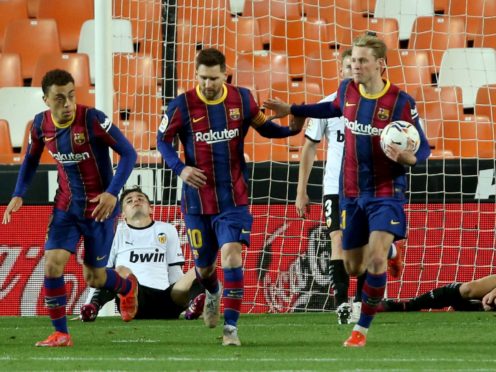 Barcelona’s Lionel Messi celebrates scoring his side’s first goal (Alberto Saiz/AP)