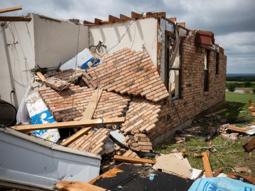 The lodge at the Barn on the Brazos wedding venue is shown after being destroyed by a tornado in Blum, Texas (Yffy Yossifor/Star-Telegram via AP)
