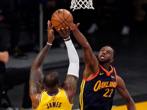 LeBron James lets fly with the three-pointer that proved to be a game winner (Mark J. Terrill/AP)