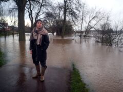 Environment Minister Rebecca Pow at the swollen river in Worcester (Steve Parsons/PA)