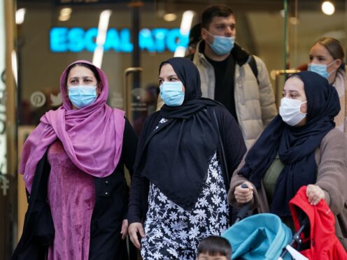 Shoppers leave a Primark in Birmingham, as mask wearing in stores and on public transport becomes mandatory. (Jacob King/PA)