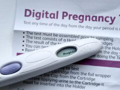 A pregnancy test kit indicating pregnancy (Gareth Fuller/PA)