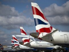 Airlines will be forced to operate more flights this summer to avoid losing lucrative take-off and landing slots at the UK’s busiest airports (Victoria Jones/PA)