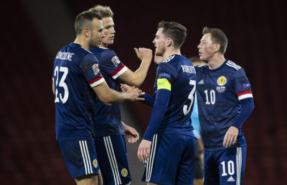 Scotland's Andy Considine, Andy Robertson and Callum McGregor (L-R) at full time after Slovakia match.