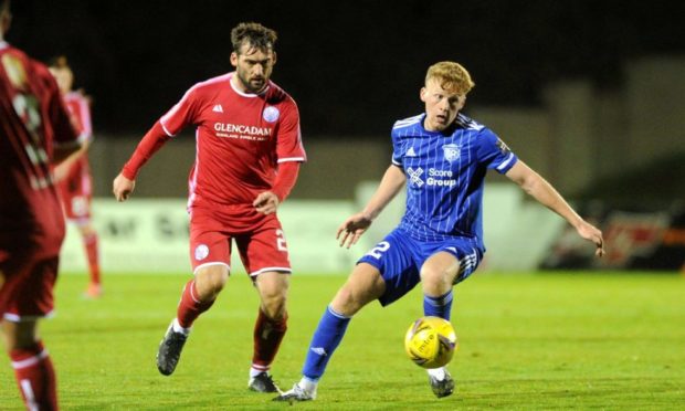 Brechin's Michael Paton up against Peterhead's Andrew McCarthy.