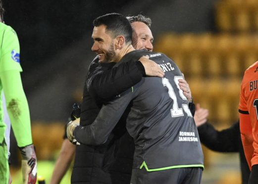 Micky Mellon and Dundee United goalie Deniz Mehmet celebrate.