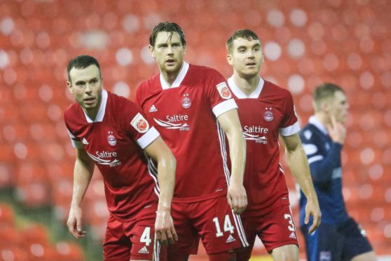 Left to right, Aberdeen defenders Andrew Considine, Ashton Taylor and Tommie Hoban.