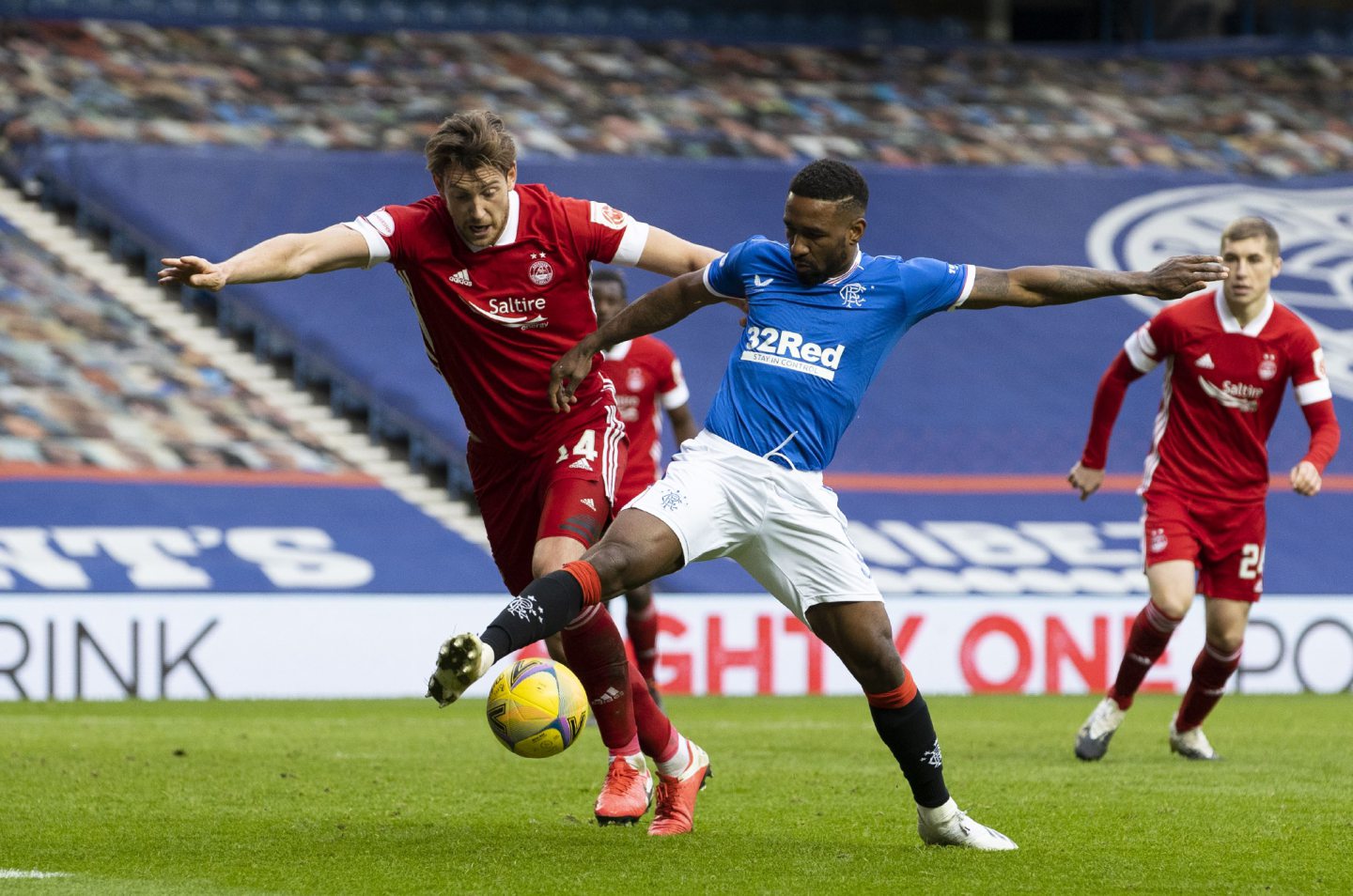 Aberdeen's Ash Taylor tangles with Rangers' Jermain Defoe at Ibrox on November 22.