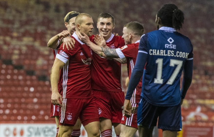 Aberdeen's Curtis Main celebrates with teammates after making it 2-0 during the Scottish Premiership match between Aberdeen and Ross County at Pittodrie, on December 12.