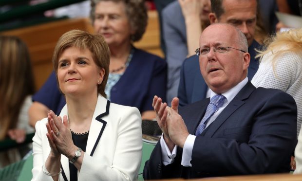 Nicola Sturgeon sitting beside her husband former SNP chief executive Peter Murrell at Wimbledon