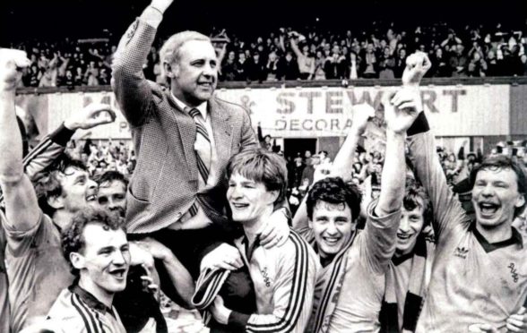 Jim McLean held aloft by his Dundee United players after winning title at Dens Park.