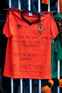 Dundee United fans pay tribute to Jim McLean outside Tannadice.