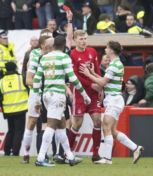 Aberdeen's Sam Cosgrove is sent off by referee Bobby Madden on his debut against Celtic in 2018.