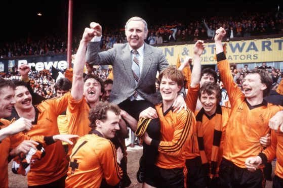 Jim McLean is held aloft by his players after United's title triumph at Dens Park.