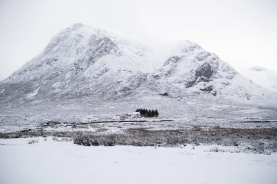 Fresh snow covers Buachaille Etive Mor in Glencoe on Sunday, December 27, 2020.